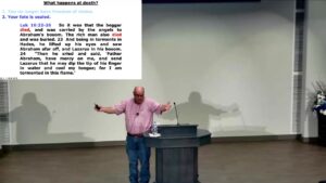 Preaching at Valley Church of Christ with Luke 16 on the screen